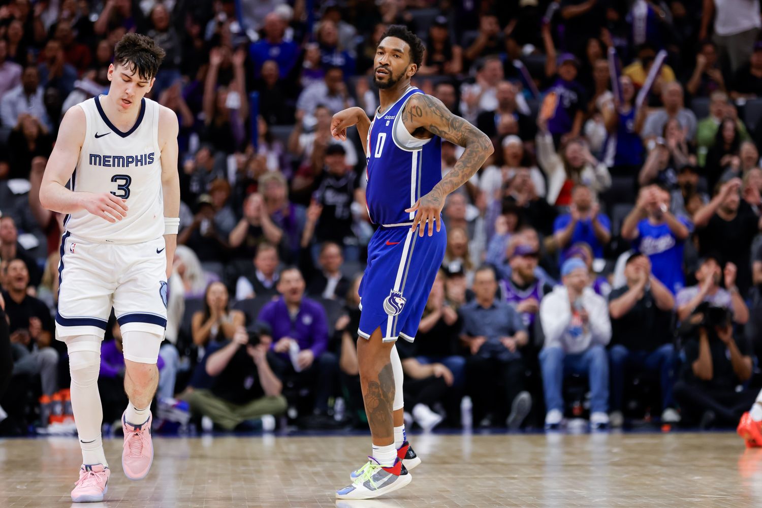 Mar 18, 2024; Sacramento, California, USA; Sacramento Kings guard Malik Monk (0) celebrates after scoring a basket during overtime against the Memphis Grizzlies at Golden 1 Center. Mandatory Credit: Sergio Estrada-USA TODAY Sports
